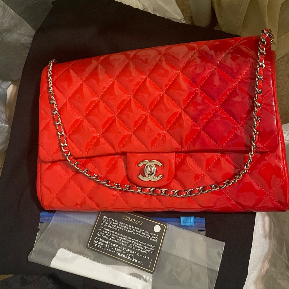 Red patent Chanel classic flap clutch with chain